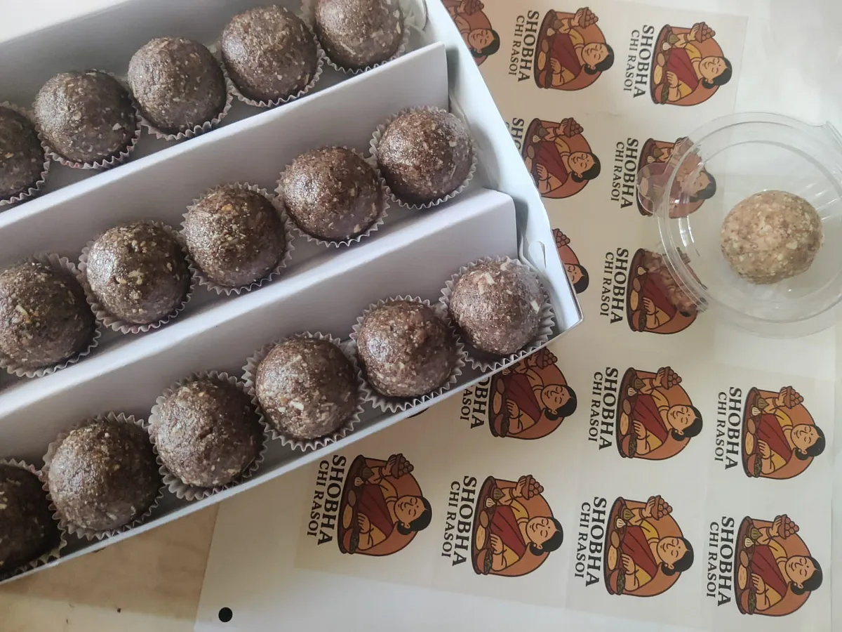 Boxes of date and dry-fruit laddoos with Shobha Chi Rasoi stickers
