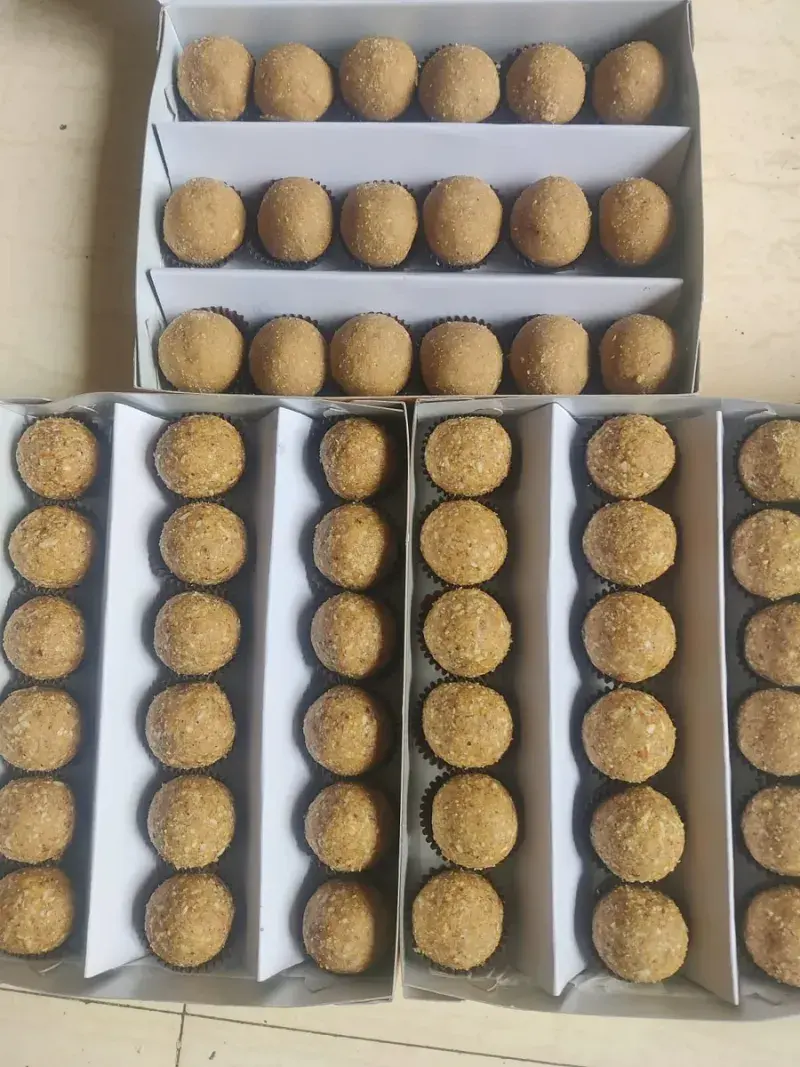 Boxes of Dink + Methi laddoos seen from above