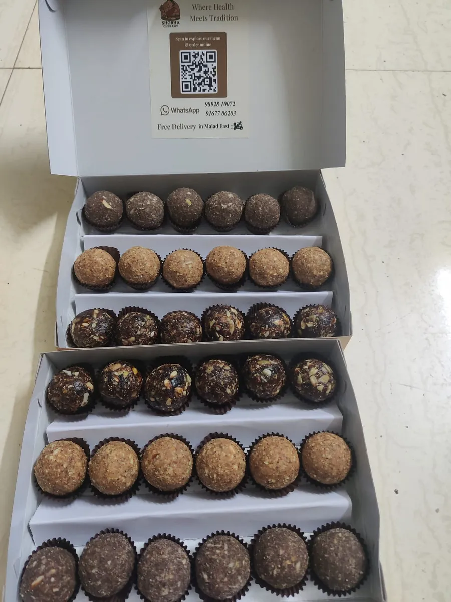 Two boxes of assorted energy laddoos ready for delivery