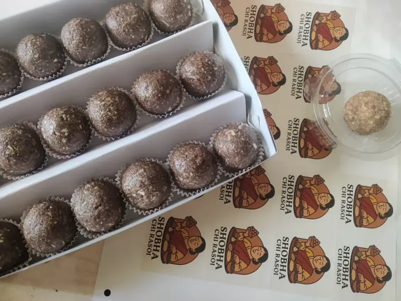 Boxes of ragi laddoos with Shobha Chi Rasoi stickers